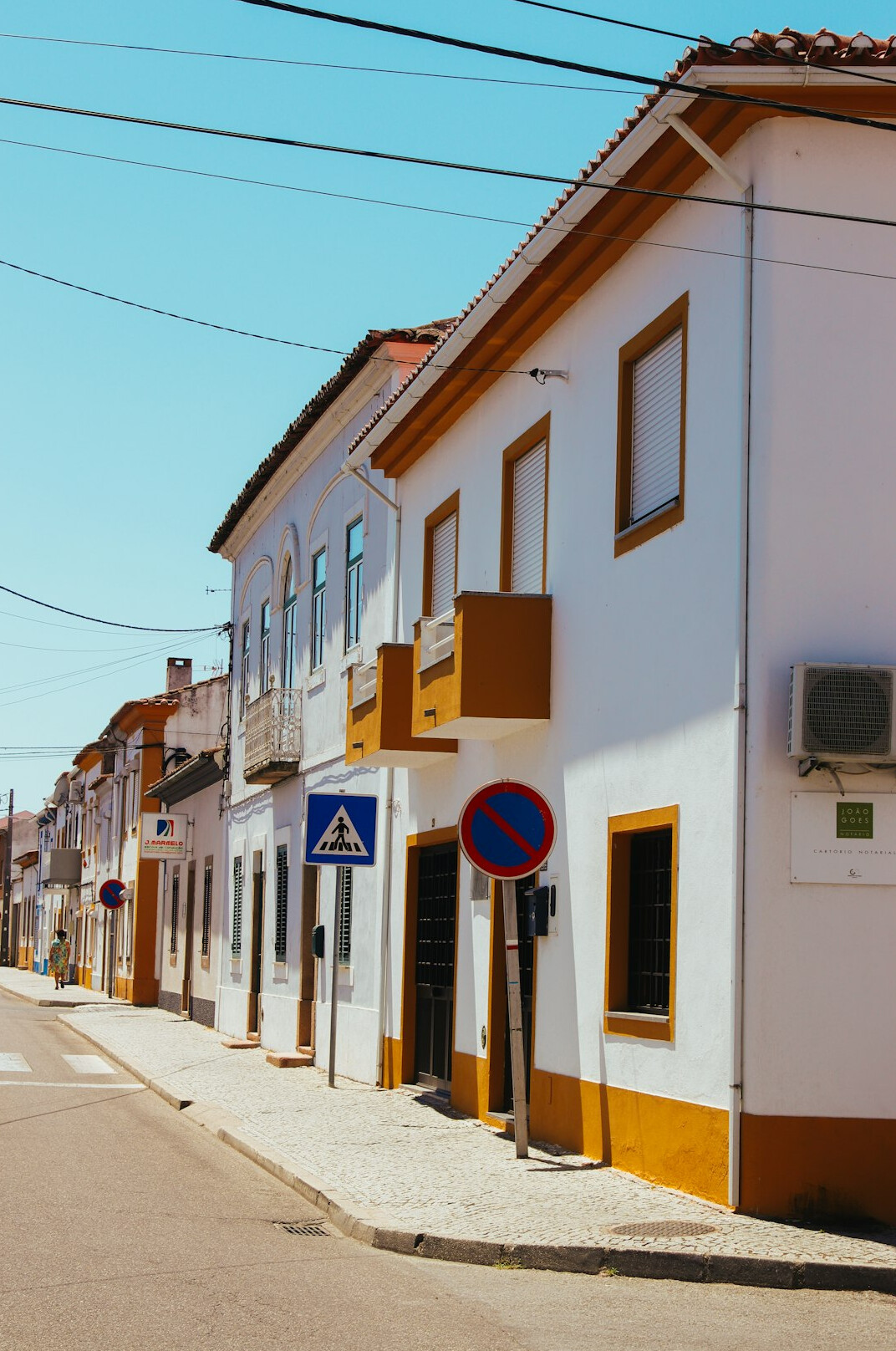 Row of rental apartment buildings with a for-rent sign in Portugal